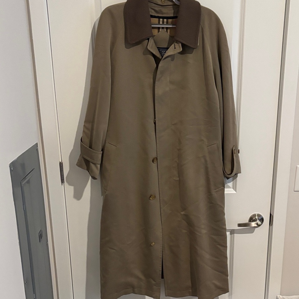 Burberrys’ Tan Trench Coat( the original pre-1999 name of Burberry)